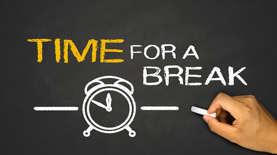 time for a break concept on blackboard background