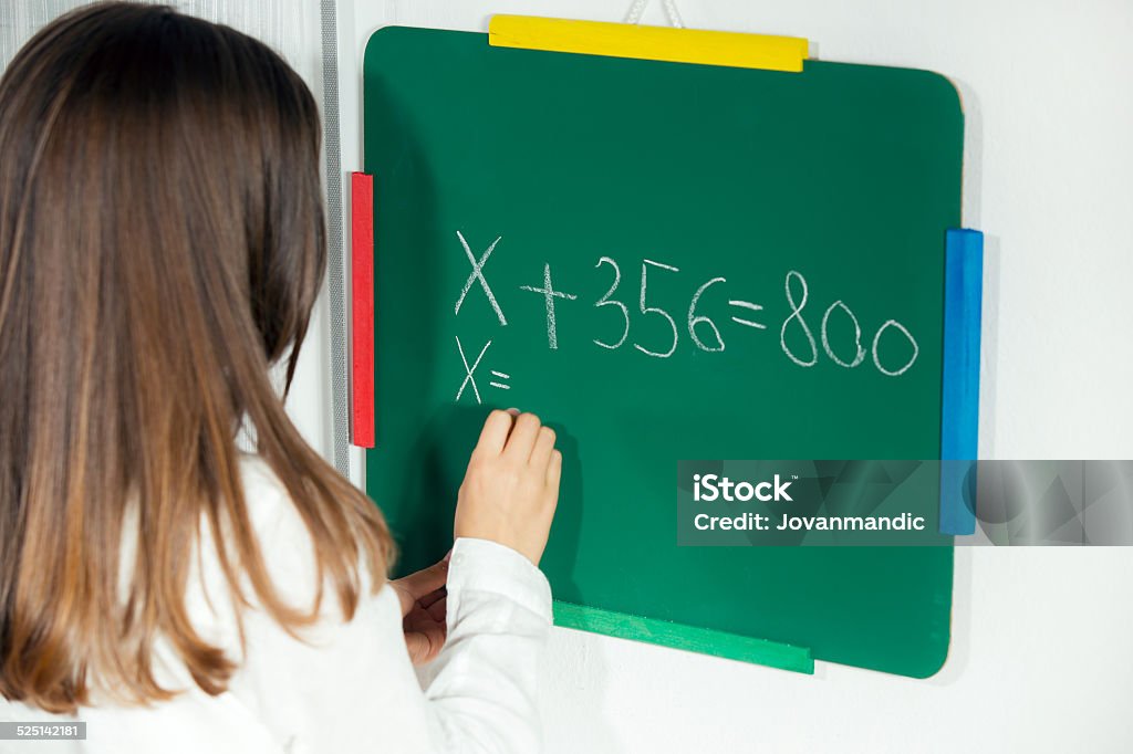 Doing Math Stock Doing Math Problems On The Blackboard Stock Photo - Download Image Now ...