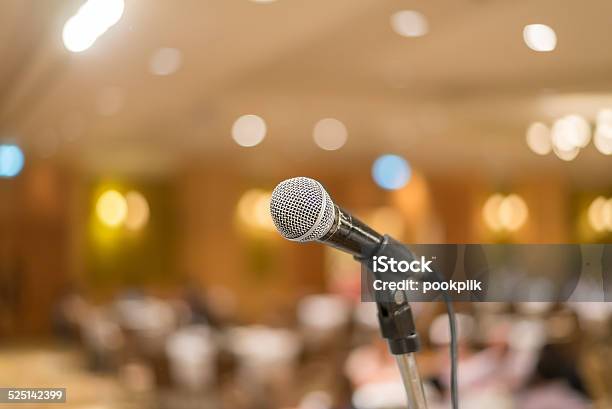 Microphone In Concert Hall Or Conference Room Lights Background Stock Photo - Download Image Now