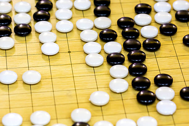 istock closeup of stones on a Go board 525143563