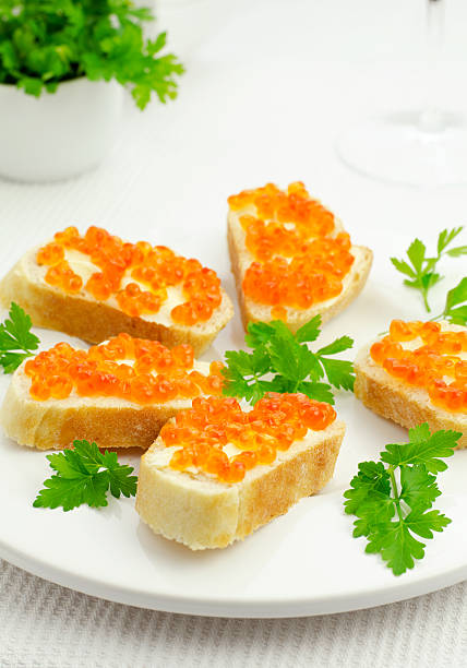 Red caviar on bread stock photo
