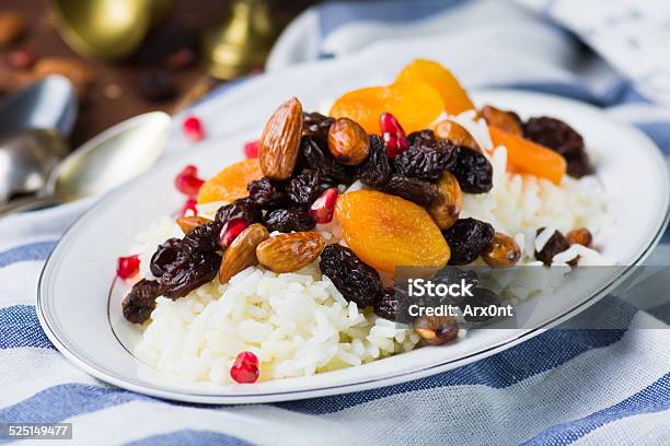 Sweet Rice Plov With Dried Fruits And Nuts Stock Photo - Download Image Now - Almond, Apricot, Backgrounds