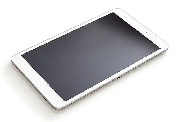 Photo of Digital tablet lying on a white table
