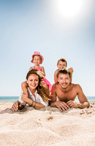 istock Happy family in sand. 525149733