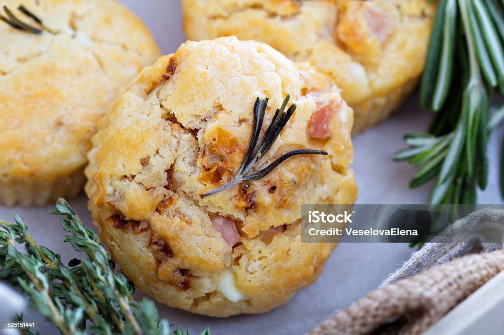 Savory muffins with herbs, tomatoes and ham Savory muffins with herbs, tomatoes, feta cheese and ham Appetizer Stock Photo