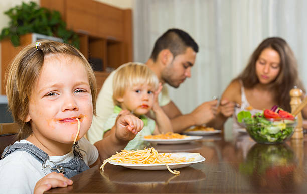 istock Family eating spaghetti 525151693