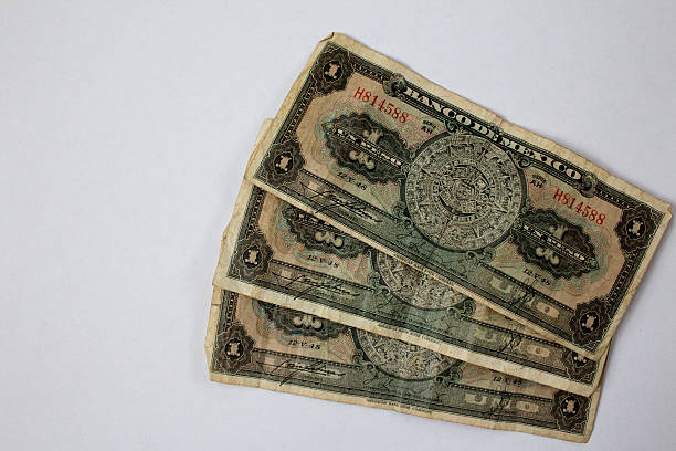 istock Three uno peso bills, obsolete Mexican currancy 525152109