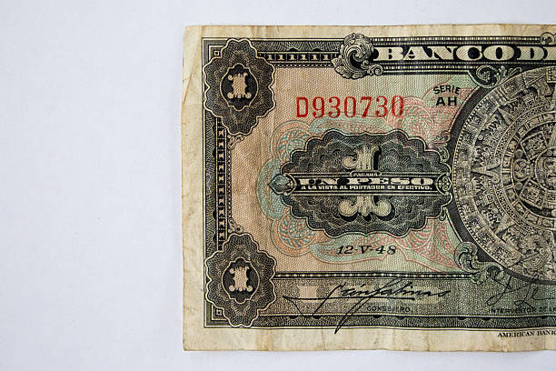 istock Half of a obsolete uno peso banknote 525152111