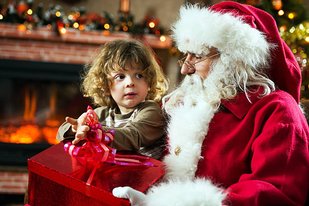 istock Santa Claus and little boy. 525154205