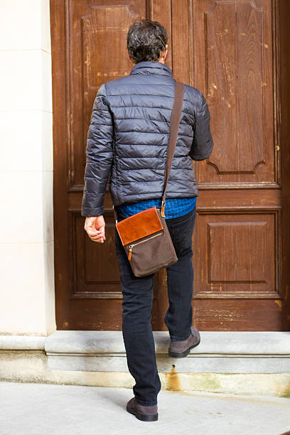istock European Man with Man-Bag Arriving Home 525156237