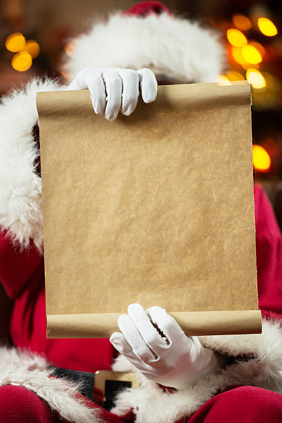 istock Santa Claus reading a list. 525172579
