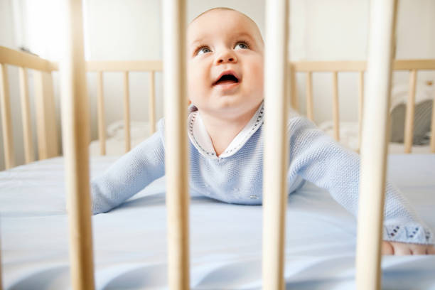 istock Baby boy in his crib 525175093