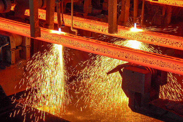 Hot Steel billets Red hot steel billets with sparks on a continuous casting machine at torch cutting in a steel plant production site barracks stock pictures, royalty-free photos & images