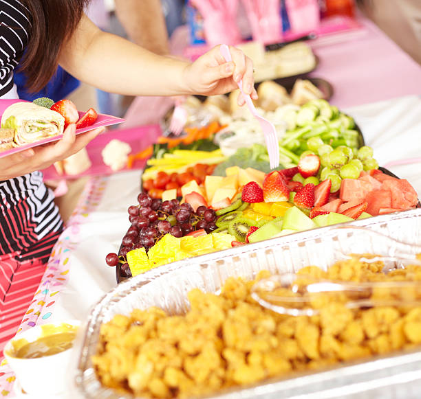 istock Woman Serving Fruit Salad For Herself In Plate 525179213