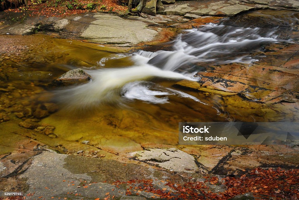 River cascade in mountain forrest River cascade in autumn mountain forrest. Long time exposure. Autumn Stock Photo