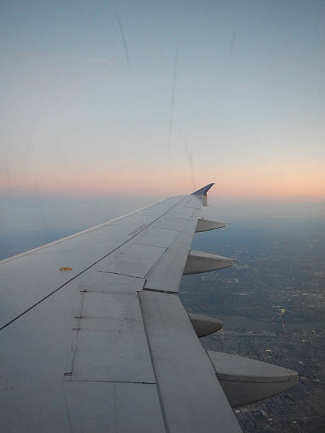 istock Air Travel - Skyline with wing 525179917
