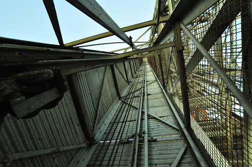 The lift shaft of a steel head frame at a decommissioned gold mine.
