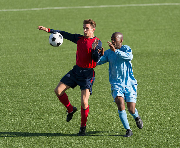 istock Two Football Players In Action 525193177