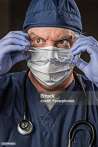 Determined Looking Doctor Or Nurse With Protective Wear And Stet Stock Photo - Download Image Now
