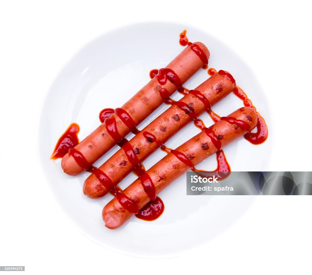 Sausages with tomato sauce from above Sausages with tomato sauce on white background viewed from above American Culture Stock Photo