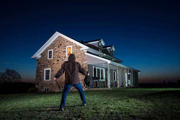 istock Burglar approaches a house 525195143