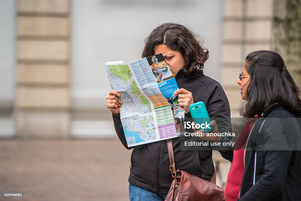 Women tourists with city map in Zurich, Switzerland Zurich, Switzerland - May 1, 2014: Women tourists with city map in Zurich, Switzerland Adult Stock Photo