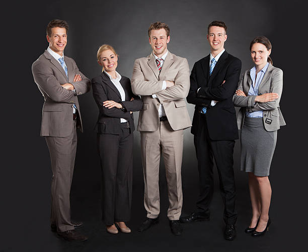 istock Confident Business Team Standing Arms Crossed 525197151