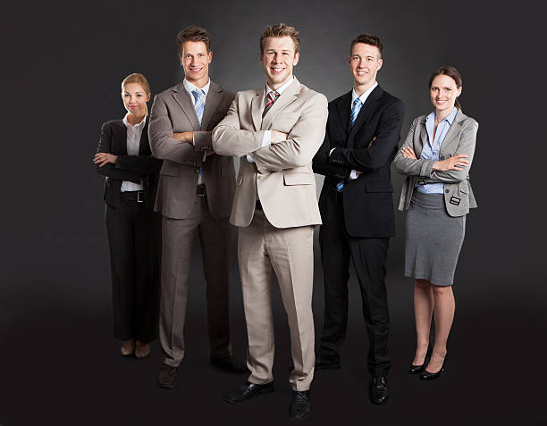 istock Confident Business Team Standing Arms Crossed 525197153