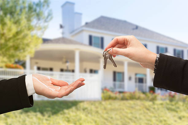 istock Handing Over The Keys and New House 525198999