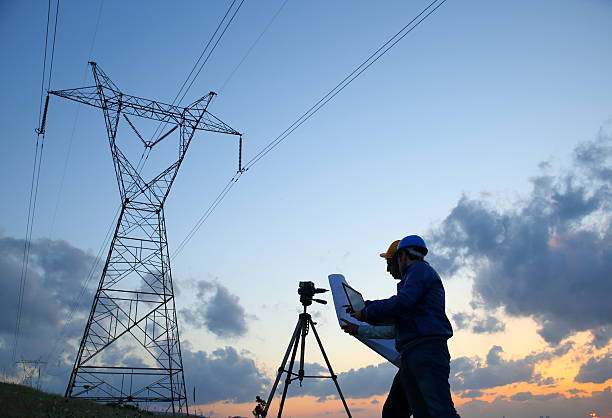 istock Silhouette of engineers workers at electricity station 525203912