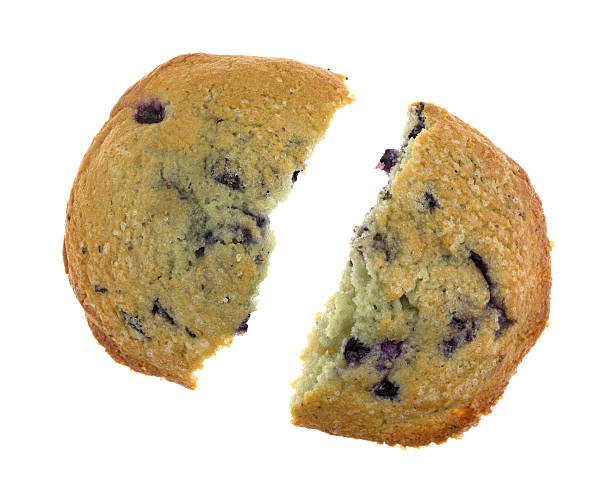 istock Freshly baked blueberry muffin top broken in half 525205070