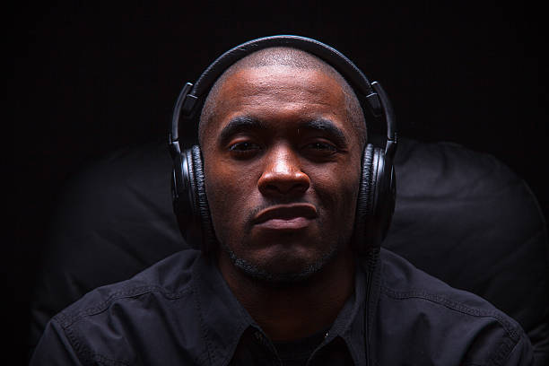 istock Sneering Man Listening to Music 525205073