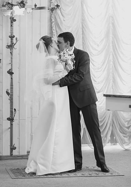 istock Black and white shot of bride and groom hugging 525205420
