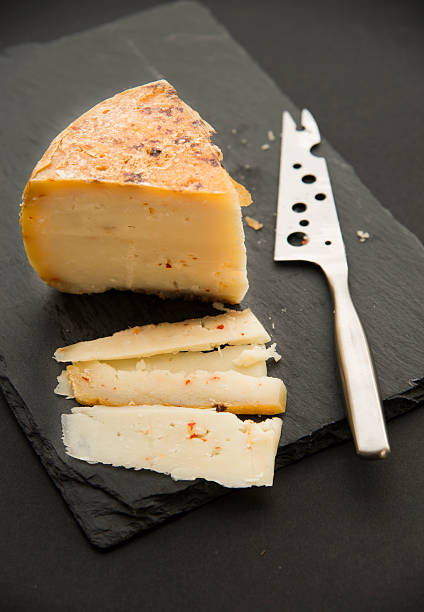istock cheese on black slate platter and knife 525205945