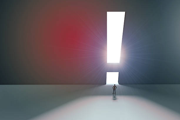 istock Figure in front of bright exclaimation mark 525206290