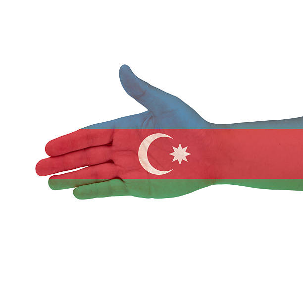 istock Azerbaijan flag on hand isolated on white background 525206717
