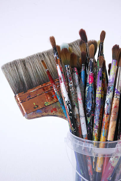 istock Different Size And Type Of Used Paintbrushes Isolated On White 525207348