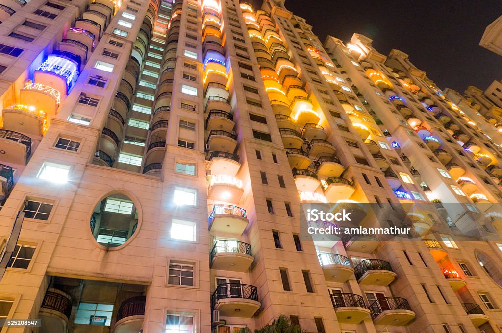 Apartments in Gurgaon at night High rise apartments in Gurgaon India beautifully lit up for the festival of diwali. The developement of Gurgaon has seen the construction of a number of skyscrapers for housing City Stock Photo
