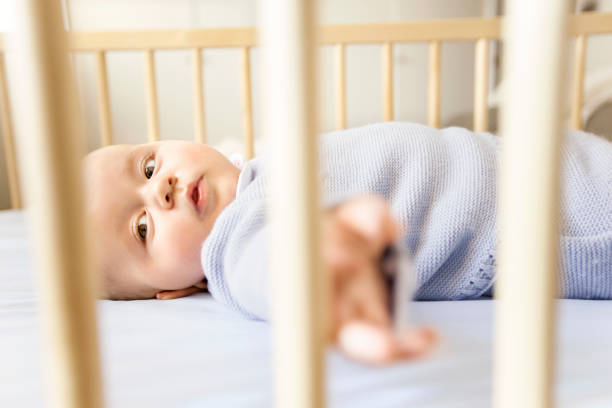 istock Baby boy in his crib 525208837