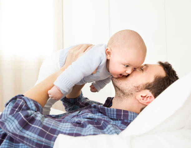 istock Father kissing baby boy 525208855
