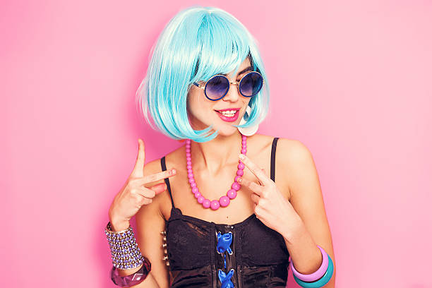 Weird and funny pop girl portrait wearing blue wig Weird and funny pop girl portrait wearing blue wig crazy makeup stock pictures, royalty-free photos & images