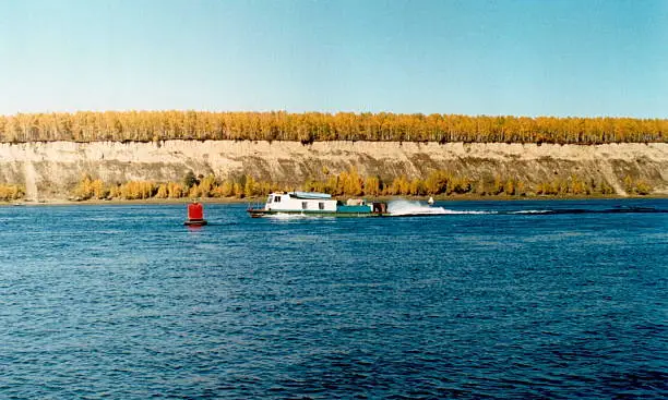 Autumn landscape, water-jet boat on the river Yenisei, retro photo