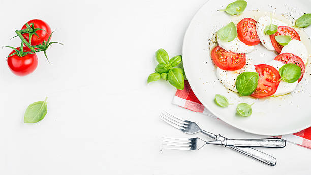 istock CLassic Italian Caprese salad with tomatoes, mozzarella di Buffala and 525211762