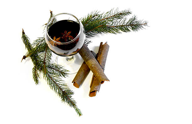istock Glass with red wine surrounded by christmas decoration 525212433