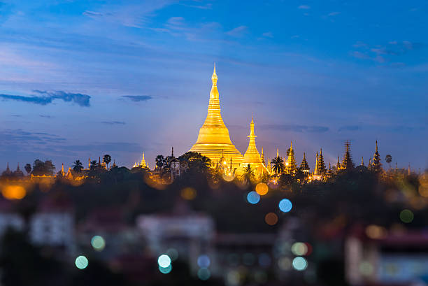 istock Shwedagon pagoda with bokeh foreground during twilight time 525213142
