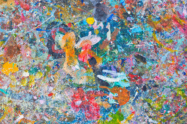 istock Abstract colorful texture background. Splash acrylic color on wood table. 525213772