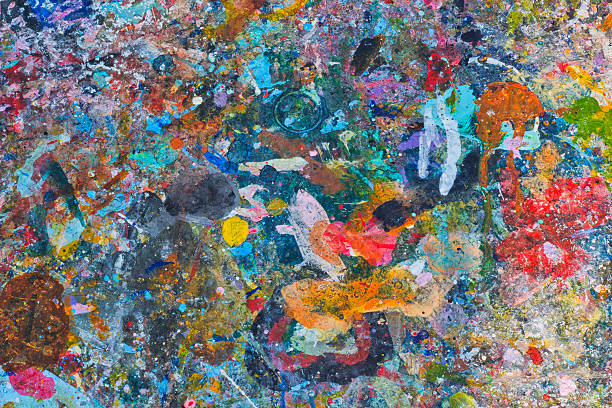istock Abstract colorful texture background. Splash acrylic color on wood table. 525214338