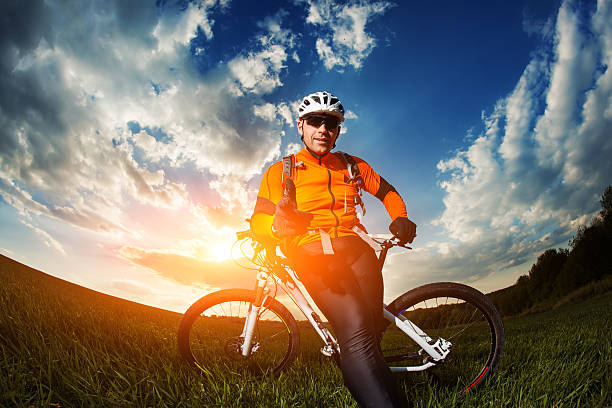 istock Cyclist with  the Bike on meadow 525214406