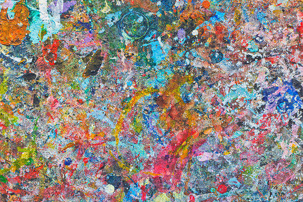 istock Abstract colorful texture background. Splash acrylic color on wood table. 525215022