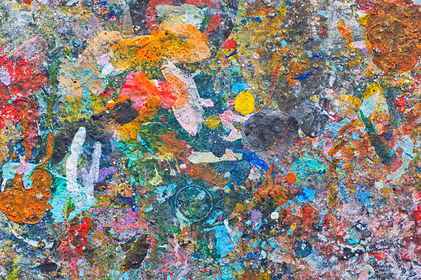istock Abstract colorful texture background. Splash acrylic color on wood table. 525215560